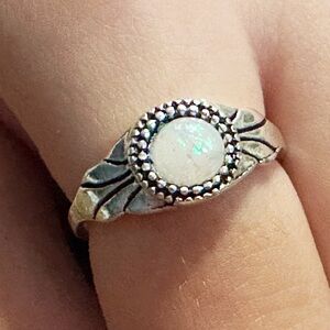 Silver ring with opalescent center stone